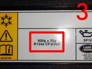 Label on the slam panel at the front of the engine bay to identify the air conditioning Gas type in your vehicle
